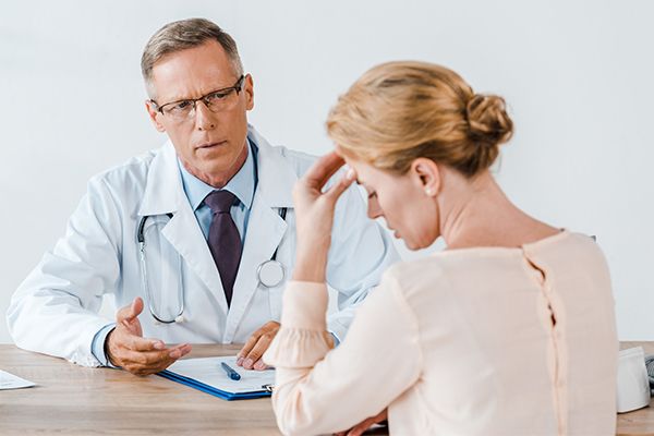 Doctor reviewing a cardiac monitor with a patient